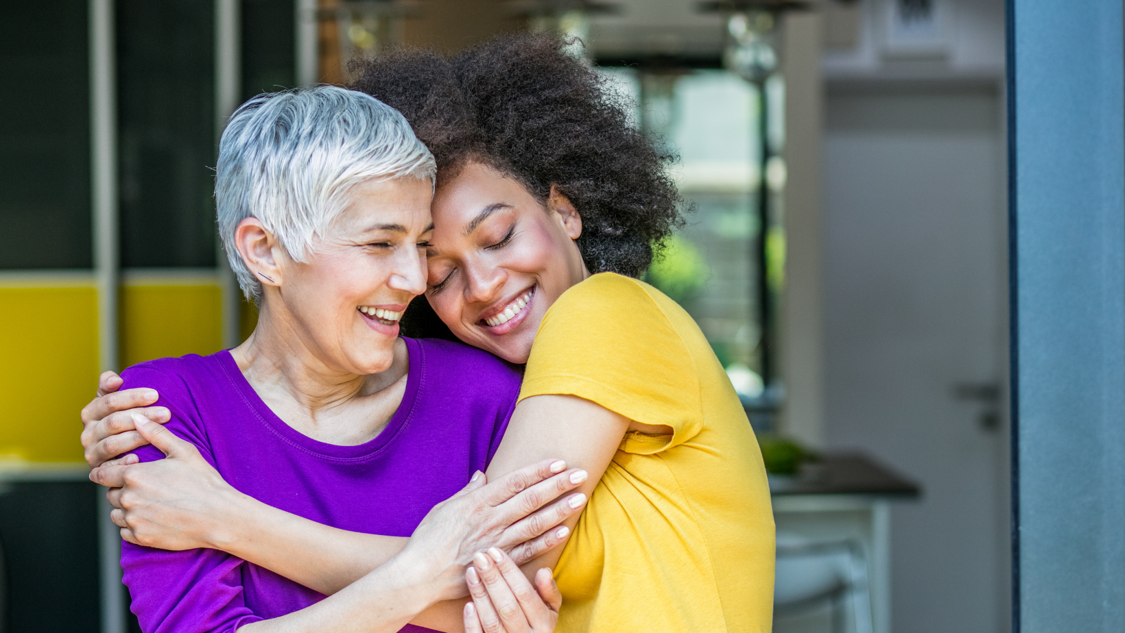 older woman hugging someone
