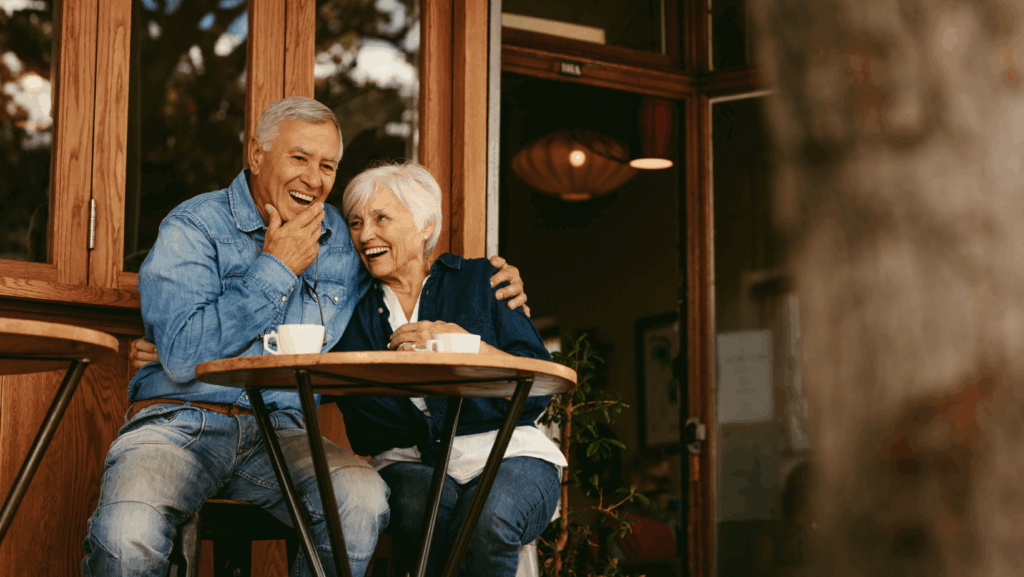 older couple sitting at table